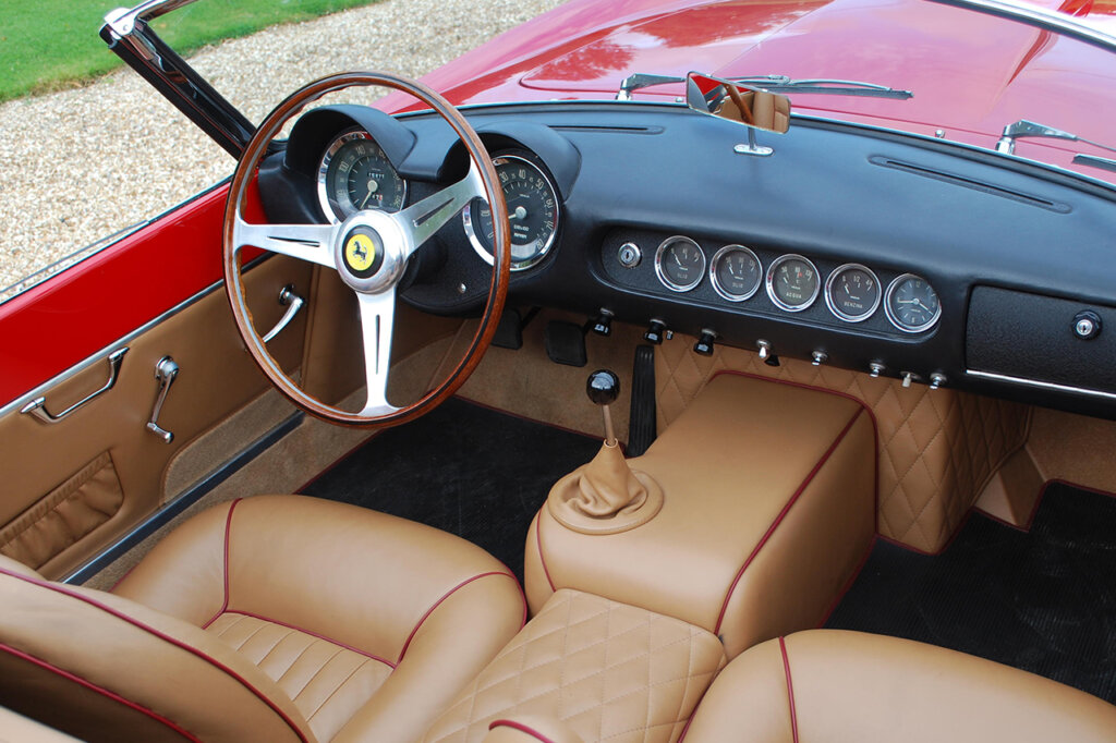 brown leather with a steering wheel with the Ferrari logo in the center