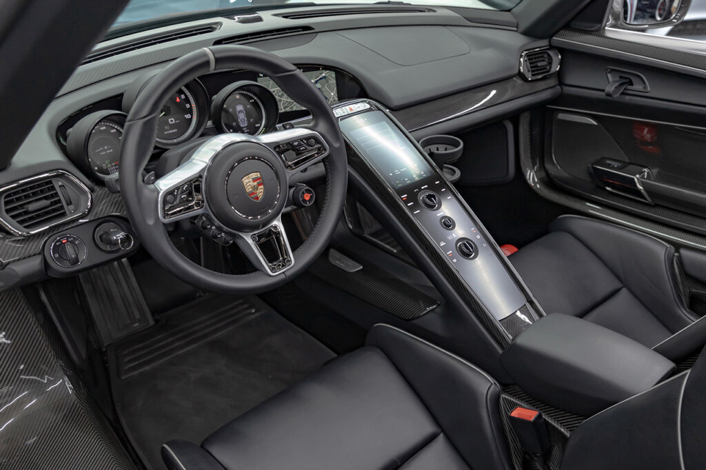Black leather and carbon fiber interior of a Porsche car
