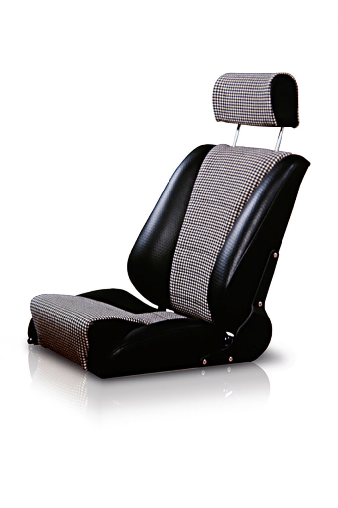 black leather with grey pattern seat sitting on a white background