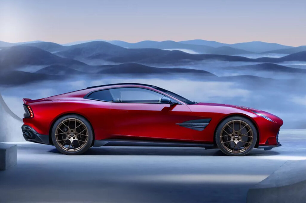 side profile of red car displayed in front of a blue background