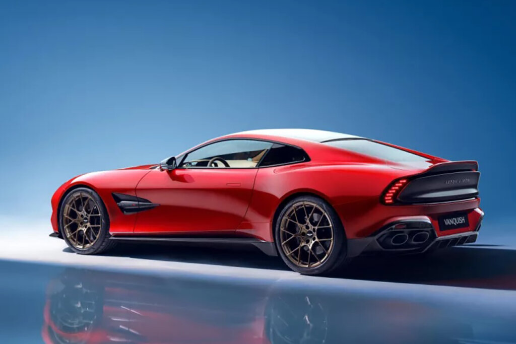 Red Aston Martin parked at an angle on a blue background