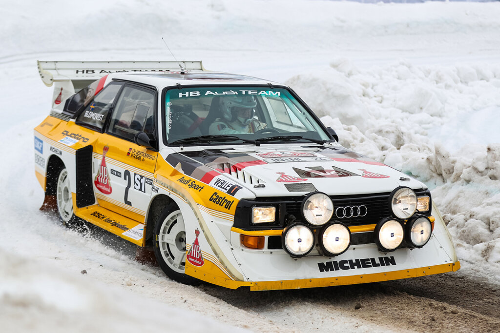 White and yellow Audi S1 E2 driving through mud and snow