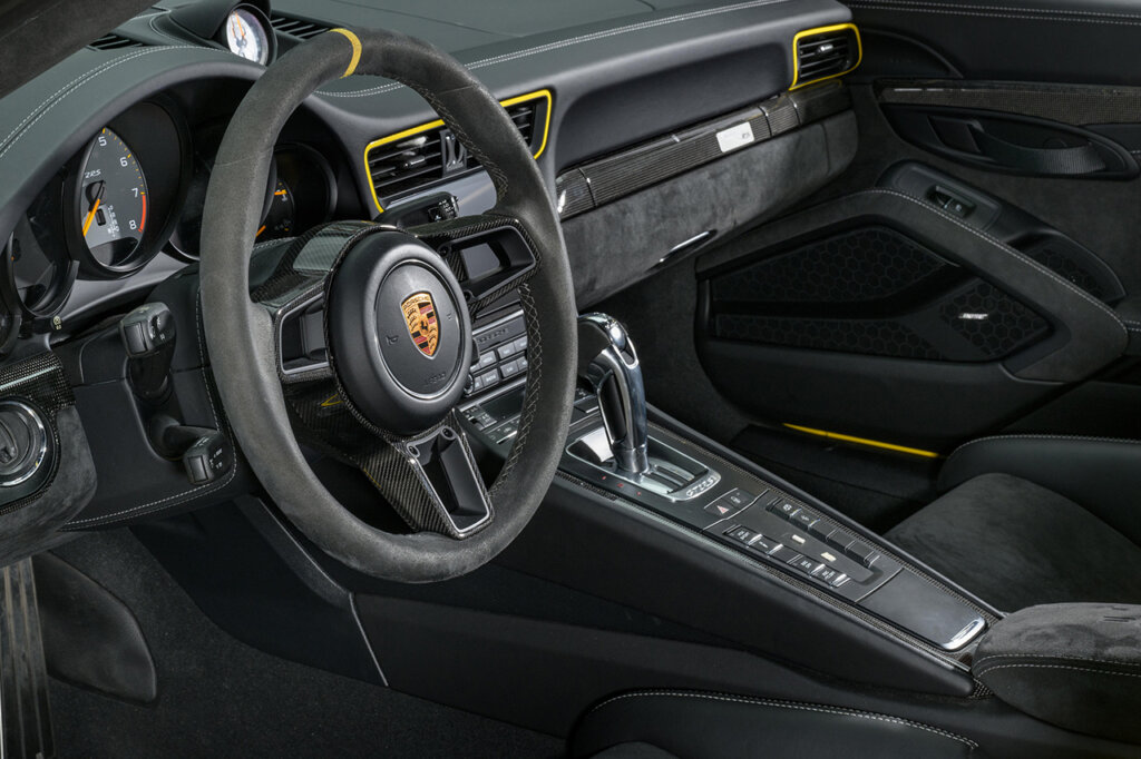 911 991 GT2 RS interior cockpit with black and yellow accents and a large center console