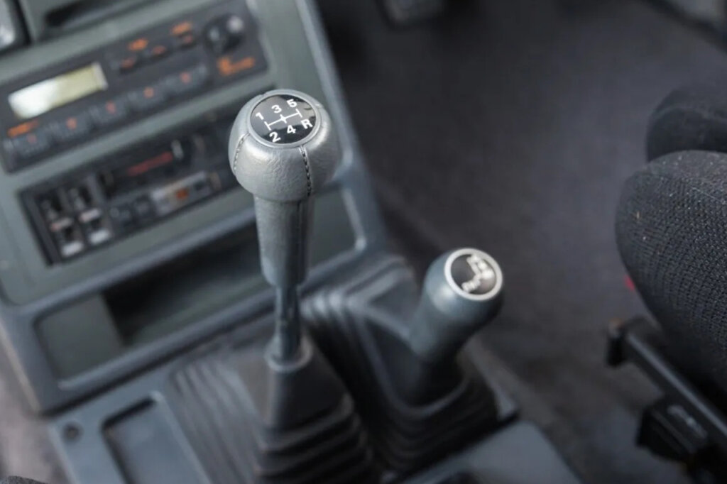 two grey manual gear selectors inside of a Mitsubishi Pajero