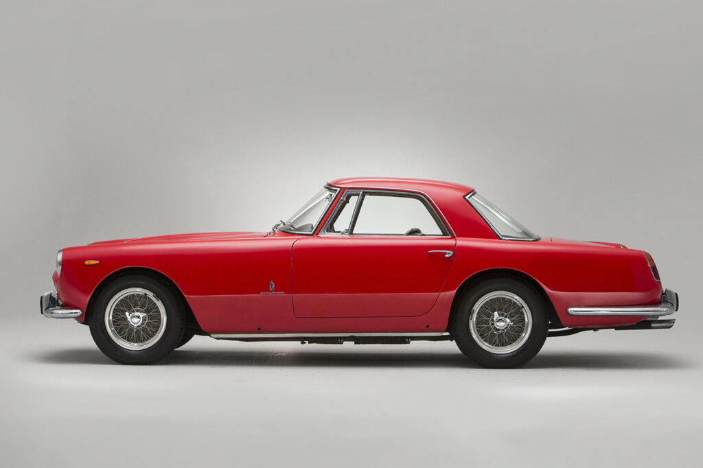 Red 250 GT side profile with chrome wheels and bumper accents
