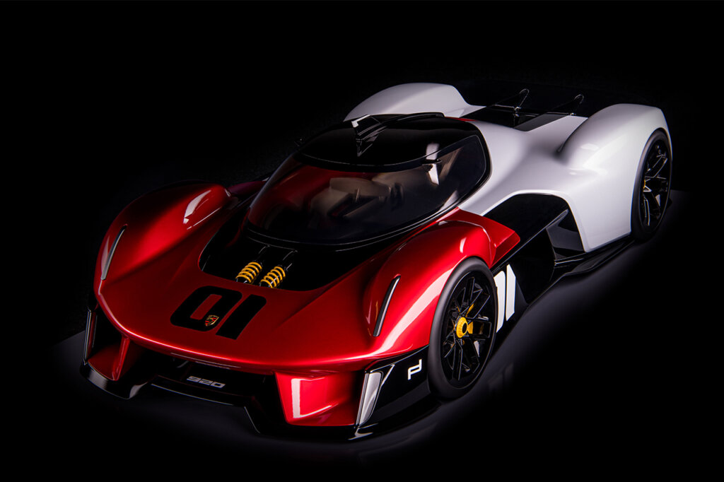 Red and white Vision 920 concept car shot at an angle on a black background.