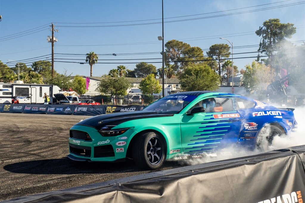 teal and blue falken formula d ford mustang drifting at sema 2024