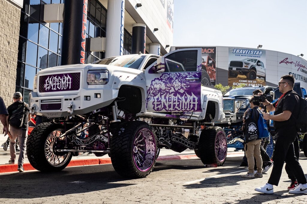 white purple custom lifted GMC truck brodozer