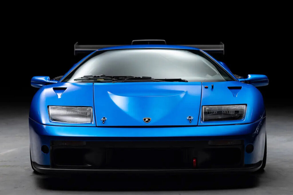 Blu Monterey Lamborghini Diablo GTR shot from the front with a large fixed rear wing with a black background.