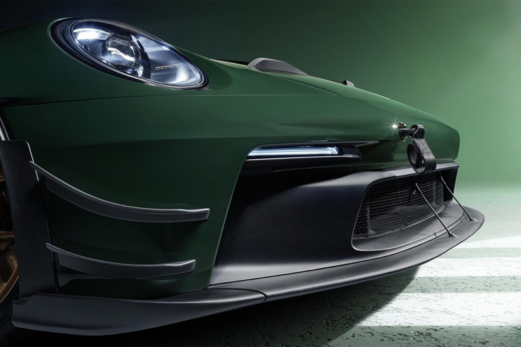 Carbon fiber front lip on a green Porsche 911