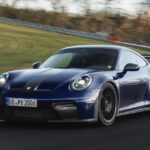 Blue porsche 911 GT3 racing at the Nürburgring