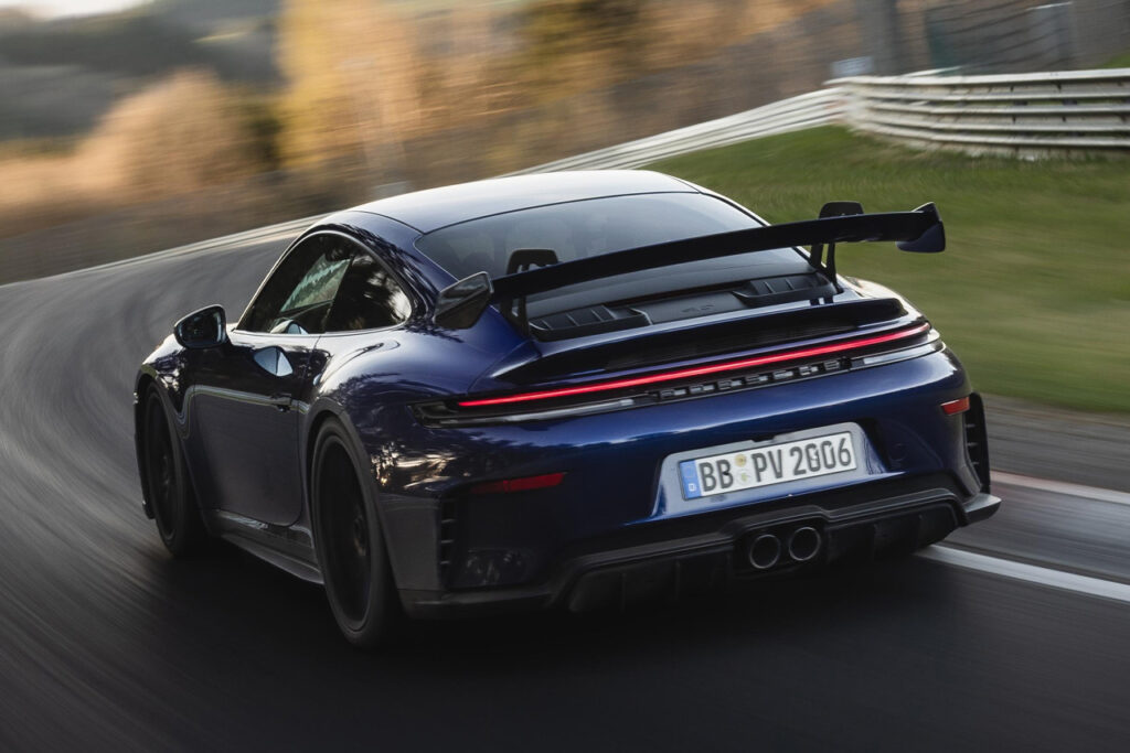 rear of blue porsche 911 gt3 on a racetrack