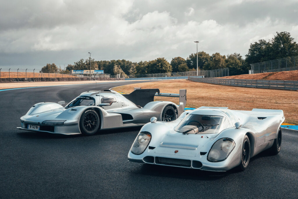Silver Porsche 963 RSP and Porsche 917 on a race track