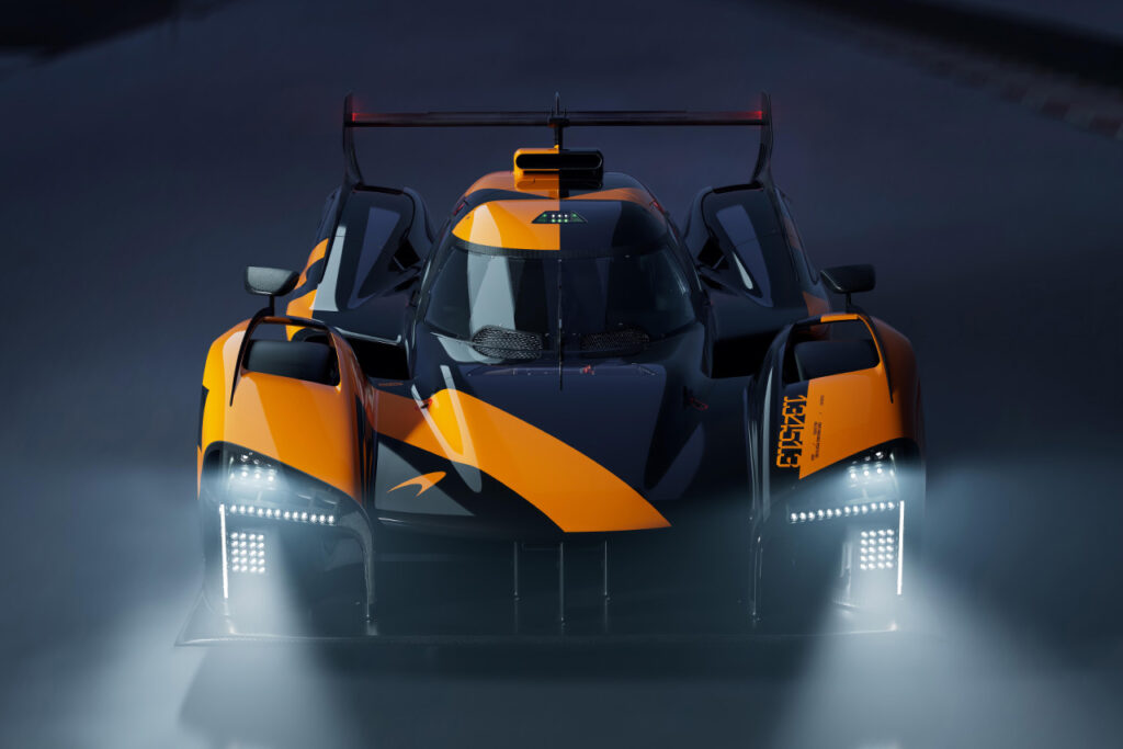 front view of Orange and black McLaren LMDh Hypercar