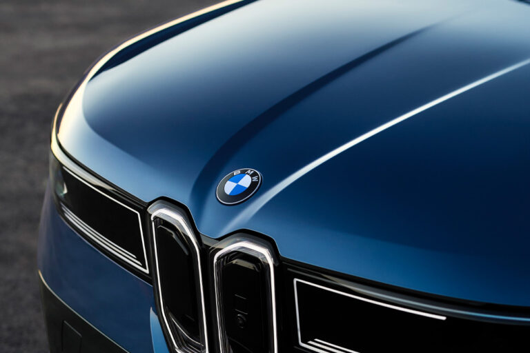 bmw badge on hood of Blue bmw ix3