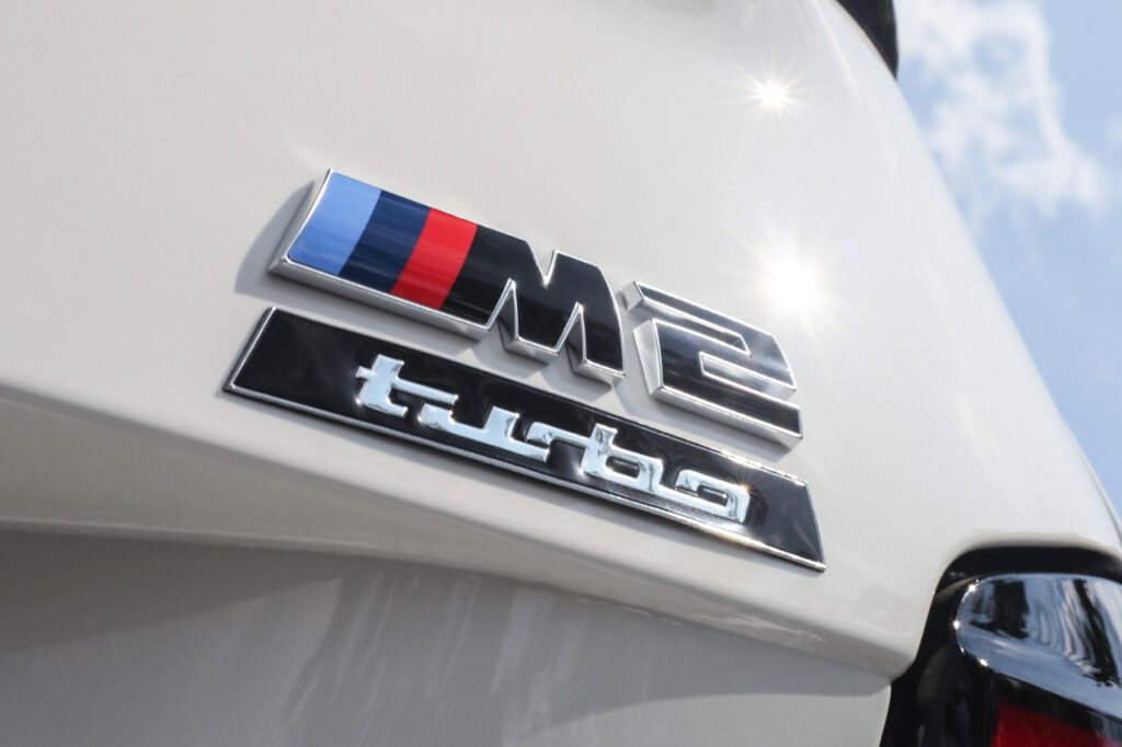 close up of badges on White BMW M2 Turbo Design Edition