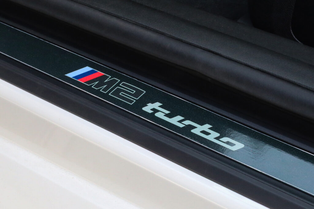 Door sill of close up of White BMW M2 Turbo Design Edition