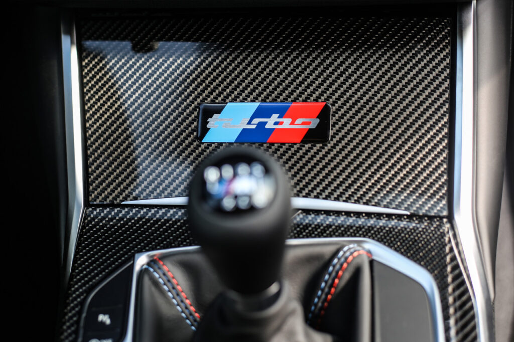cup holder cover with turbo badge inside White BMW M2 Turbo Design Edition