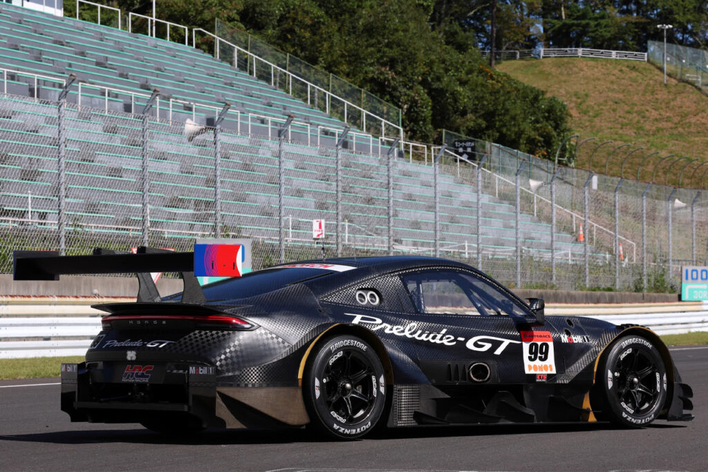 rear of black honda prelude gt500 on race track