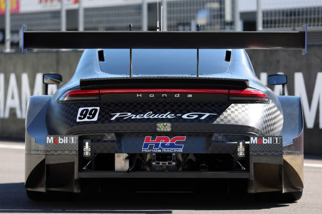 rear of black honda prelude gt500 on race track