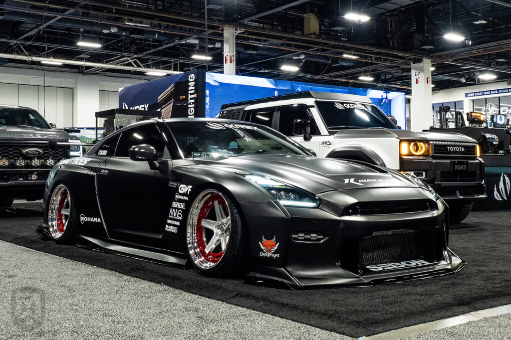 sl.zila black New Kuhl Widebody Nissan GTR at sema 2025 central hall