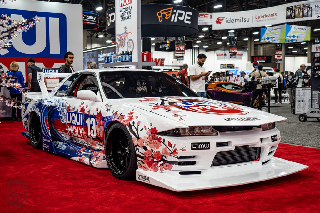 white liqui moly nissan skyline gtr r32 libertywalk at liqui moly booth sema 2025 central hall
