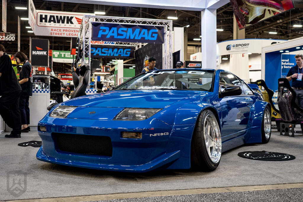 blue hardcoretokyo pandem nissan 300zx in nrg innovations booth at sema 2025 central hall