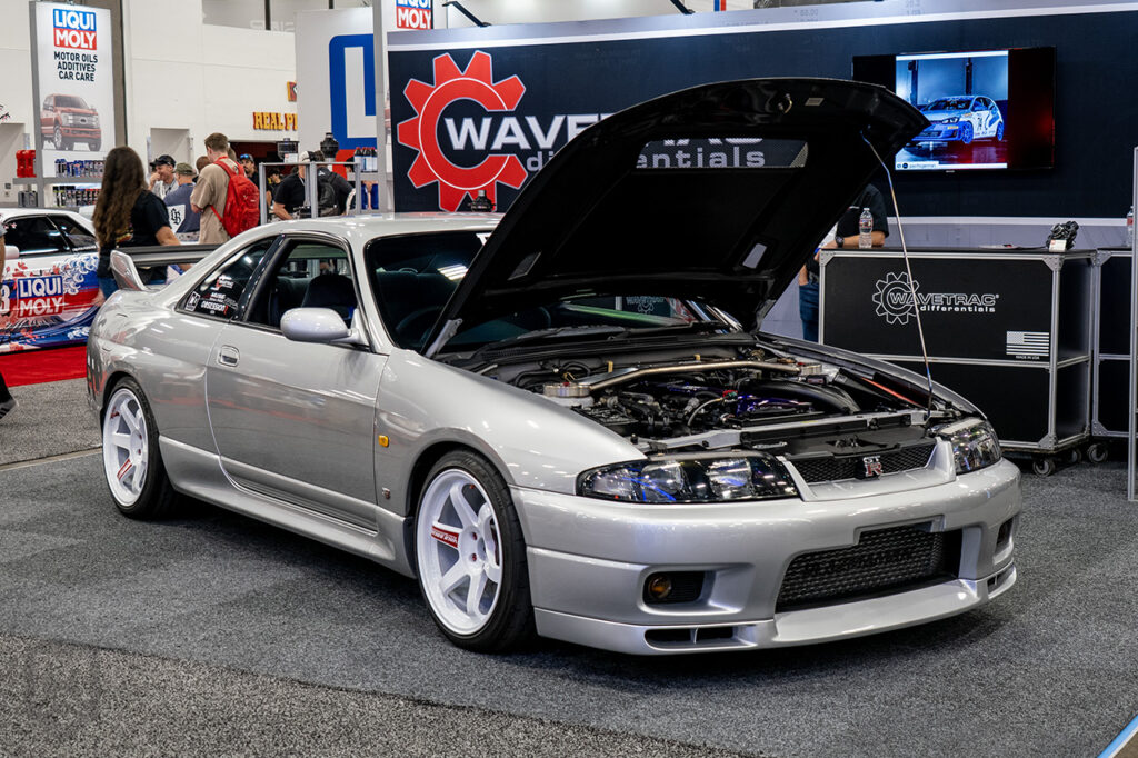 silver catuned_igor nissan skyline gtr r33 in wavetrac differentials booth at sema 2025 central hall