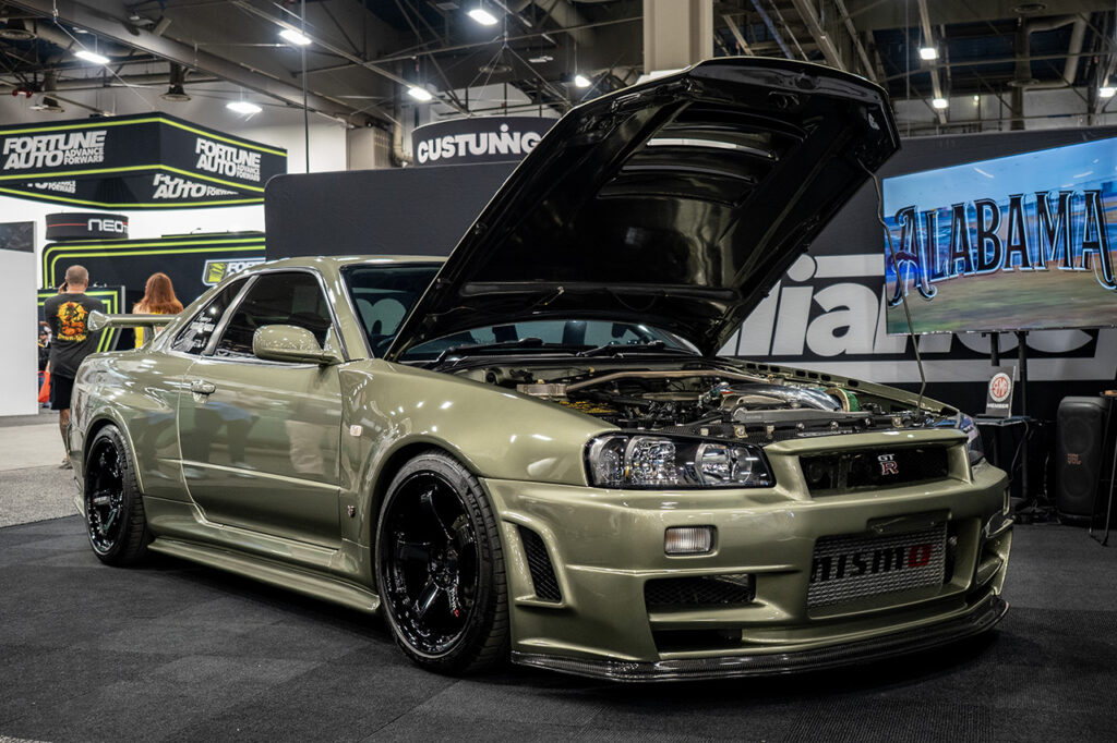 millennium jade triplejgtr nissan skyline gtr r34 in import alliance booth at sema 2025 central hall