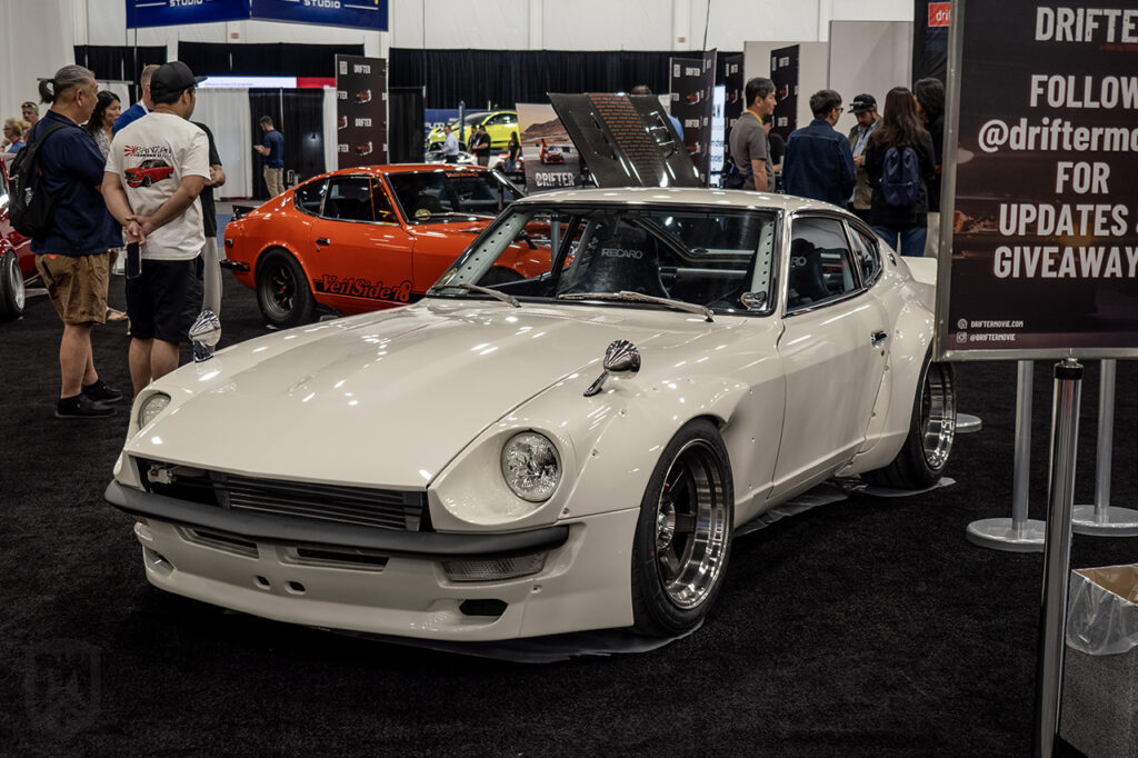white Sung Kang datsun 240z Fugu Z in Drifter booth at 2025 sema central hall