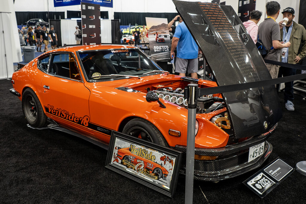orange sung kang datsun 240z at drifter booth at sema 2025 central hall