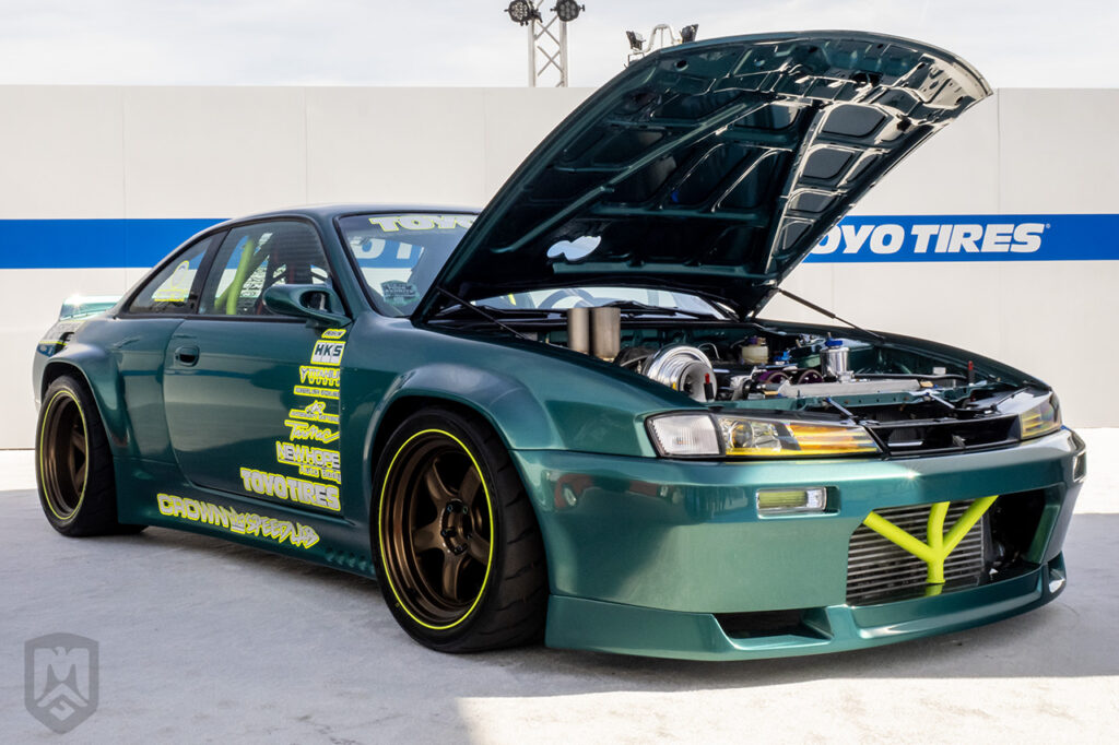 crownspeedlab green nissan s14 pandem v3 in the toyo treadpass at sema 2025