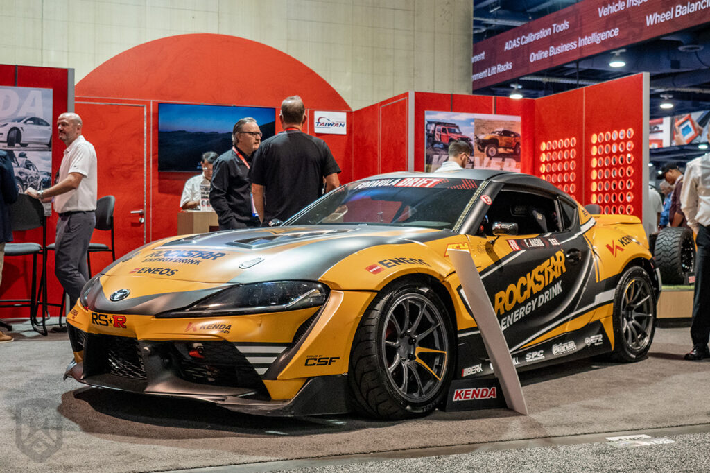 gold black fredricaasbo toyota supra gr in kenda tire booth 41025 at sema 2025 south hall lower