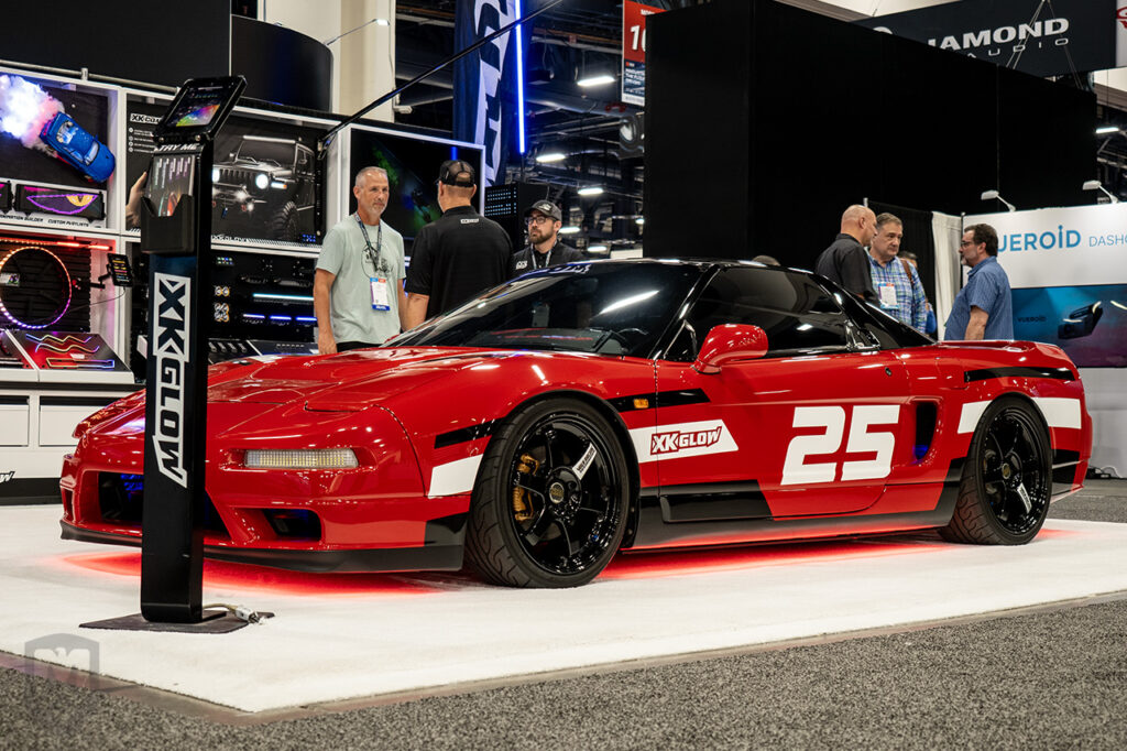 red acura nsx in the XKGlow booth 10829 at sema 2025