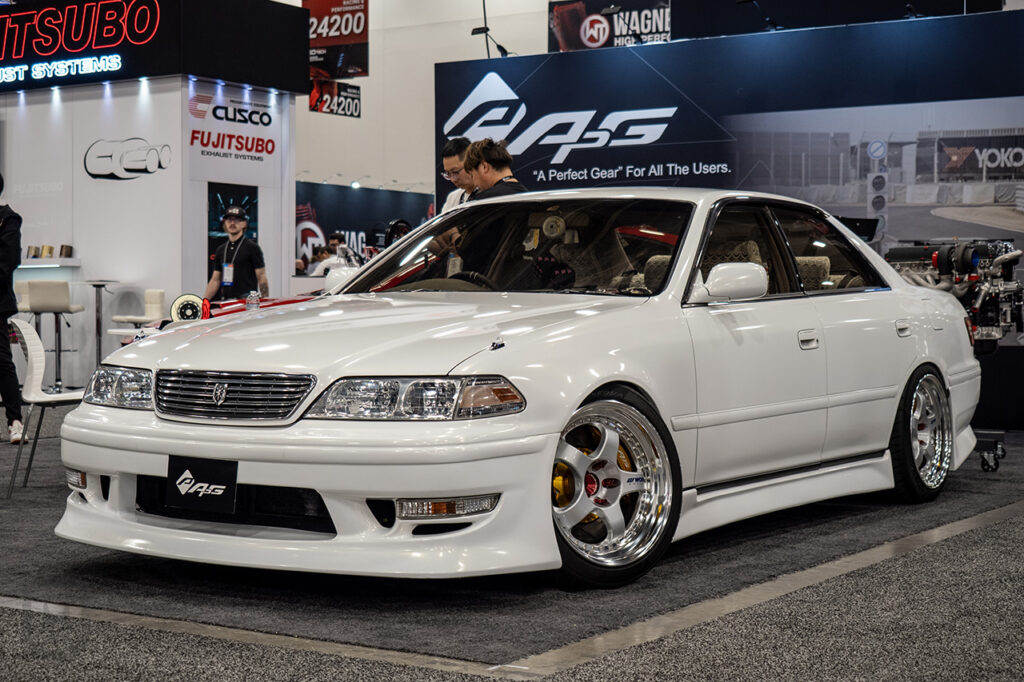 white toyota mark II in APG Performance brakes booth 24027