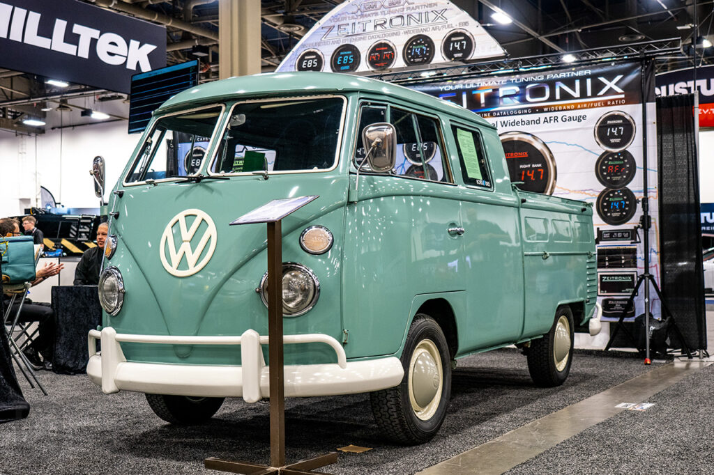 green Volkswagen Bus Type 2 in Zeitronix booth #24435 at sema 2025