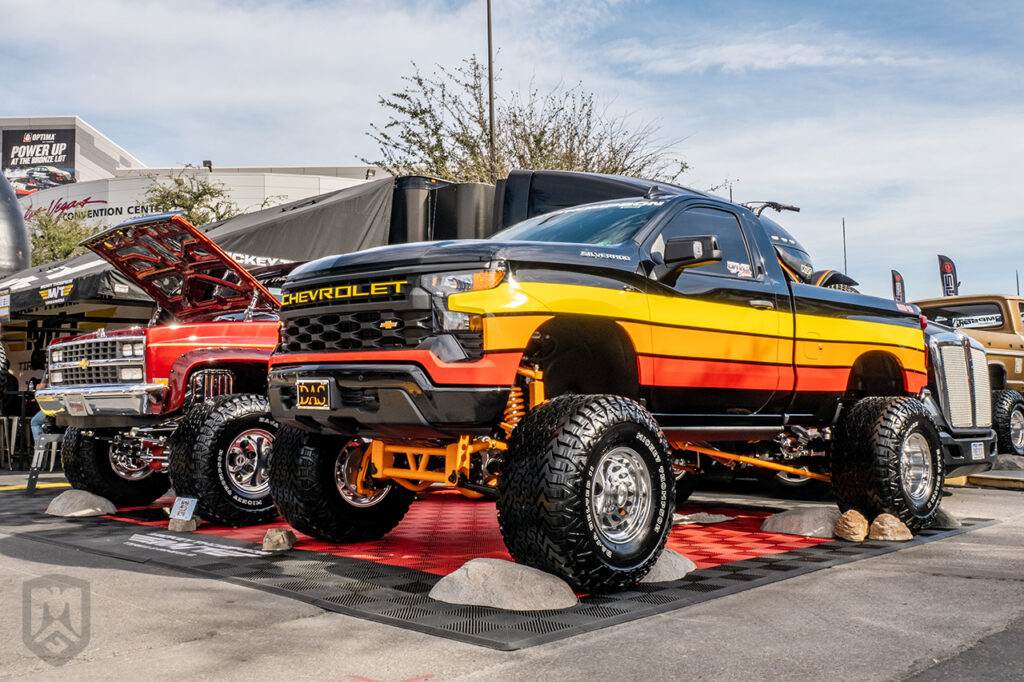 davisautosalesva red orange black chevrolet silverado at the mickey thompson booth #84180 at sema 2025