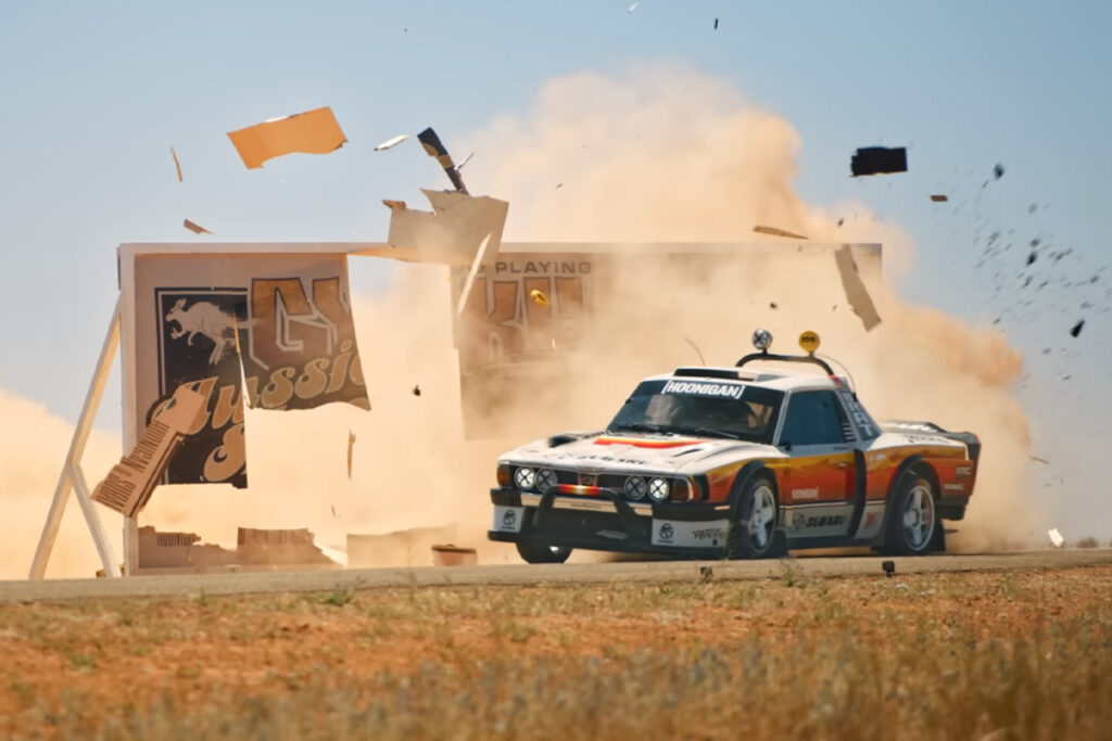 1978 subaru brat crashing through sign