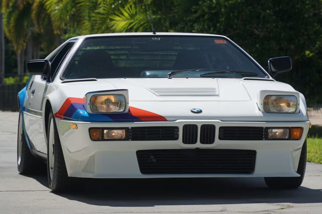 front view of niki lauda white bmw m1 art car with pop up lights